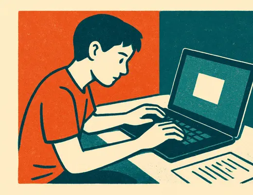 A teenager building something on a laptop